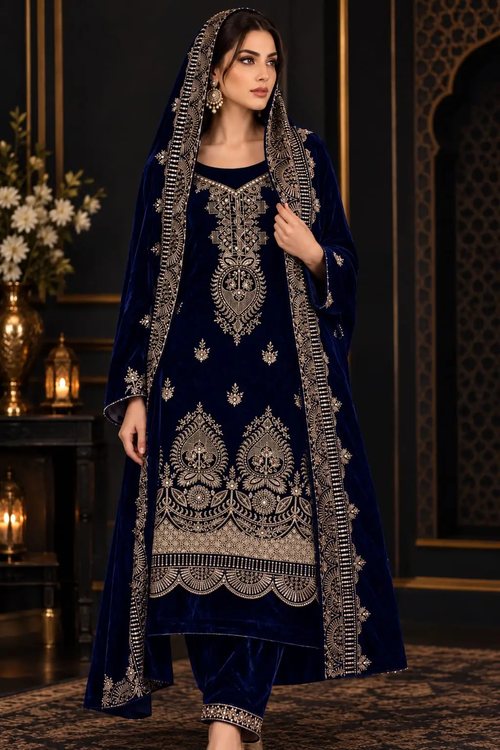 Navy blue velvet suit with gold-toned embroidery shown as a stitched styling example